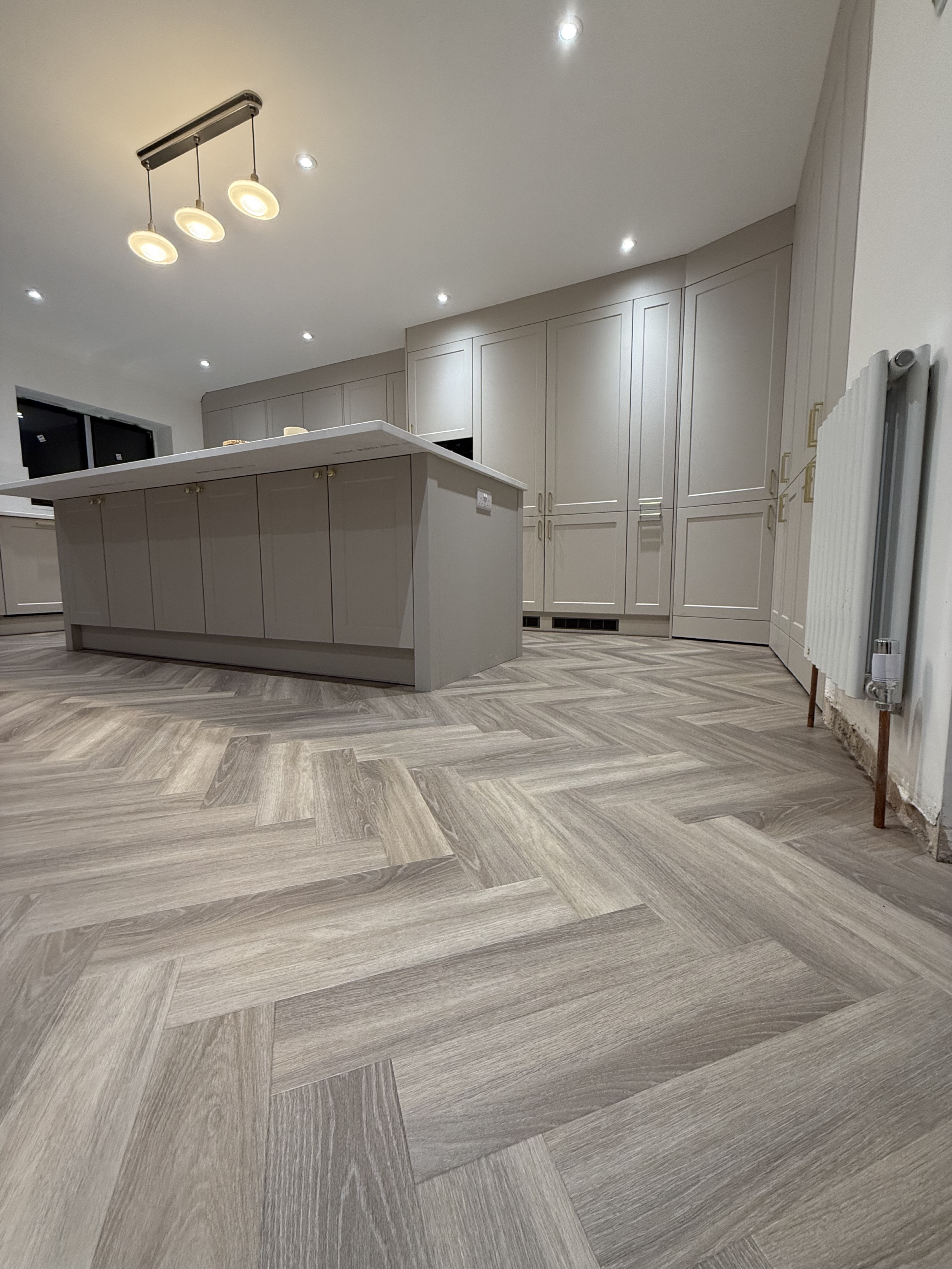 Herringbone LVT flooring in a modern kitchen